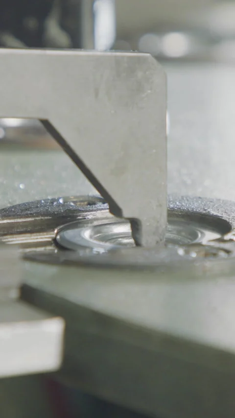 Vertical video of Advanced robotic machine manufacturing parts in an automated Stock Footage 206325281