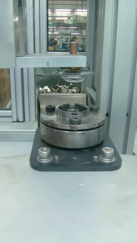 Vertical video of Advanced robotic machine manufacturing parts in an automated Stock Footage 206329320