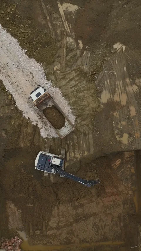 Vertical Video Aerial Construction Site Between Residential Buildings with Stock Footage 342429961