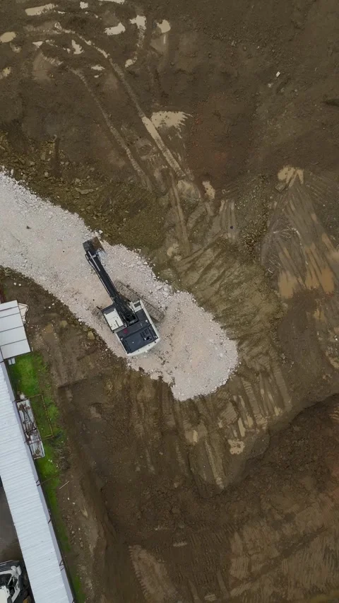 Vertical Video Aerial Construction Work with Heavy Equipment and Dirt Movement Stock Footage 342426224