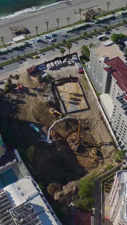 Vertical Video: Aerial Perspective of a Construction Project With Workers Video stock 342579006