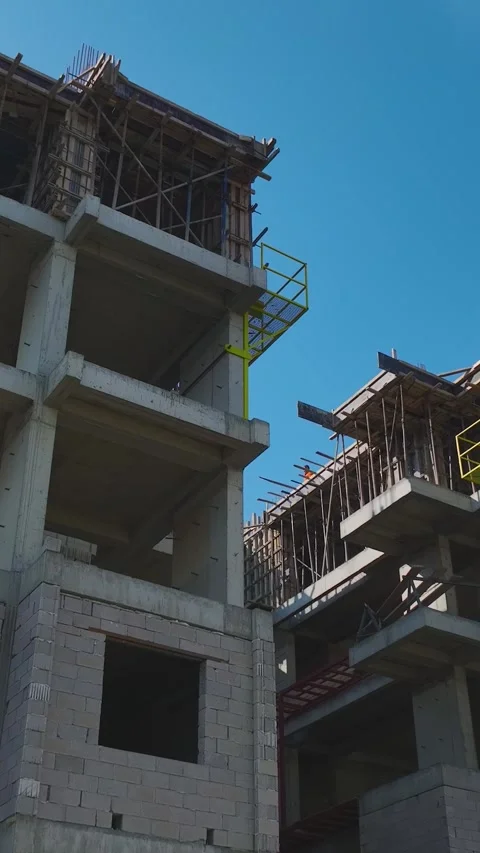 Vertical Video: Aerial Perspective of Construction Teams Handling Tools Stock Footage 342906106
