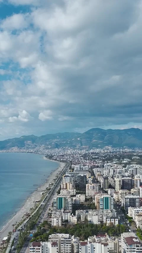 Vertical Video: Aerial Perspective of Urban Architecture With the Ocean and Stock Footage 342898285