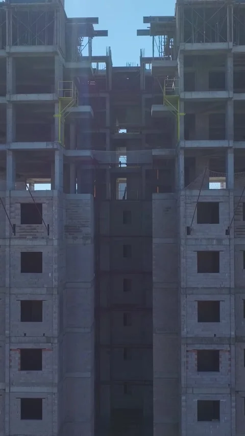 Vertical Video Aerial Shot of Builder Working on Roof Slab with Rebar and Sea Stock Footage 342472238