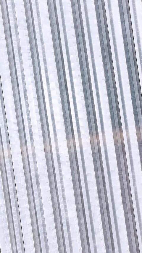 Vertical Video Aerial Texture of Plastic Covered Greenhouses Stock Footage 342079777