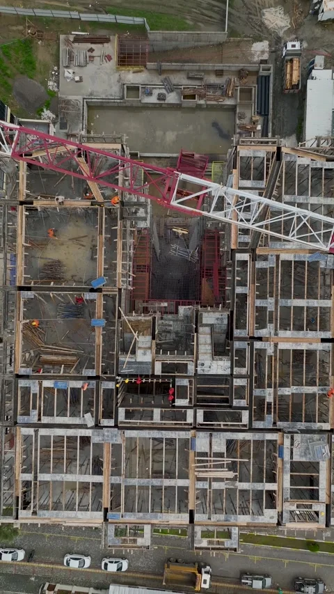 Vertical Video Aerial Urban Construction Site with Heavy Machinery and Trucks Stock Footage 342431037
