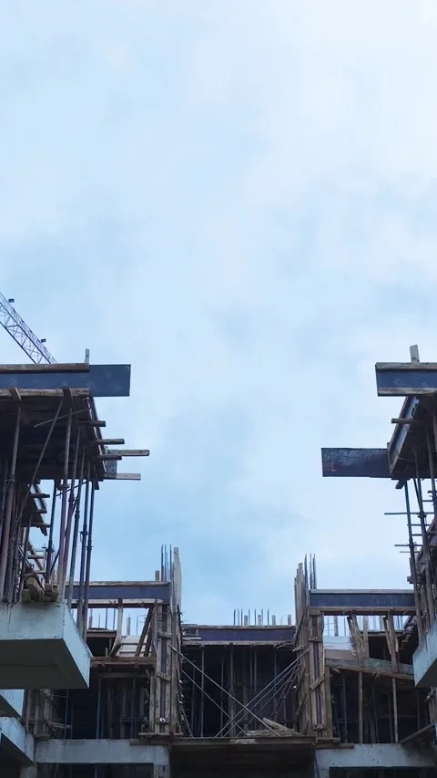 Vertical Video: Aerial View of Construction Workers Installing Supports for New Stock Footage 342562205