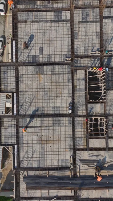 Vertical Video: Aerial View of Construction Teams Handling Materials and Stock Footage 342601609