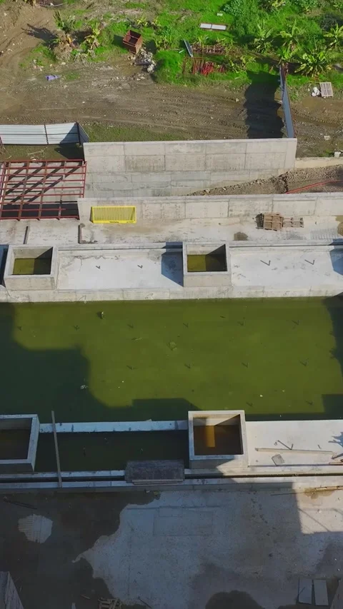Vertical Video: Aerial View of Construction Teams Using Tools, Metal, and Stock Footage 342913791