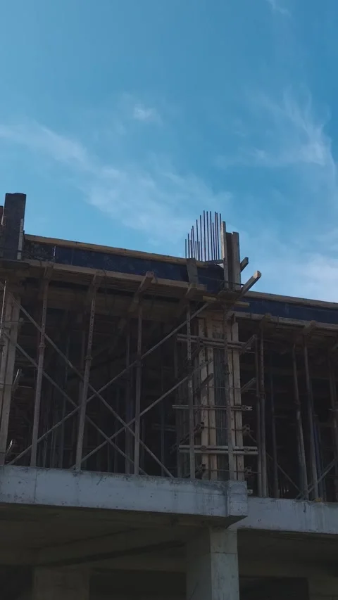 Vertical Video: Aerial View of Construction Teams Building Walls, Working With Stock Footage 342917052