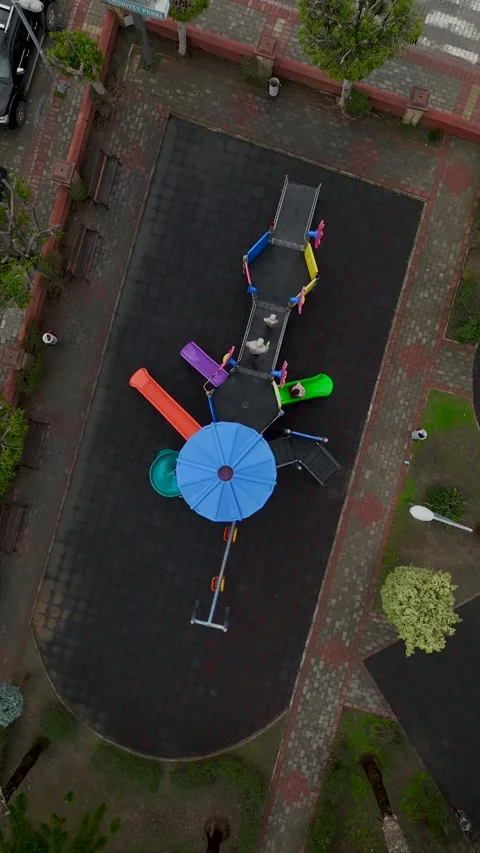 Vertical Video Aerial View of Empty Playground with Colorful Slides and Stock Footage 342426263