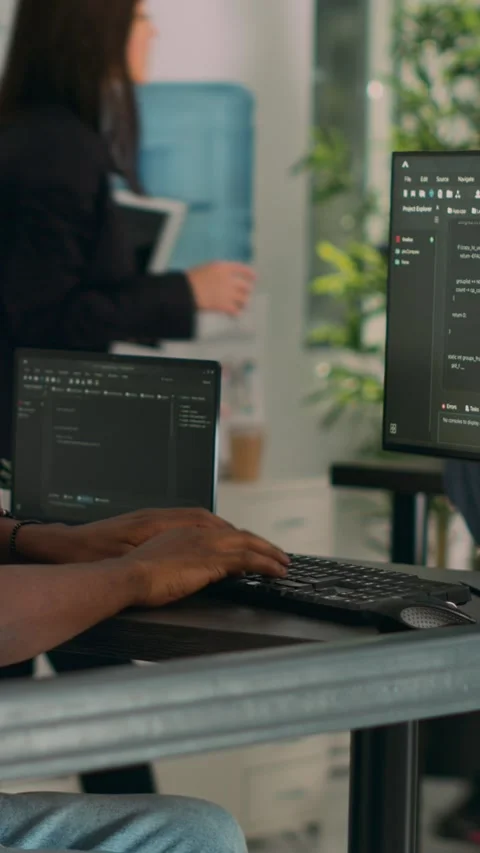 Vertical video: African american coder developing app interface with html code Stock Footage 218574414