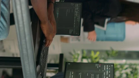 Vertical video: African american coder developing app interface with html code Stock Footage 219701614