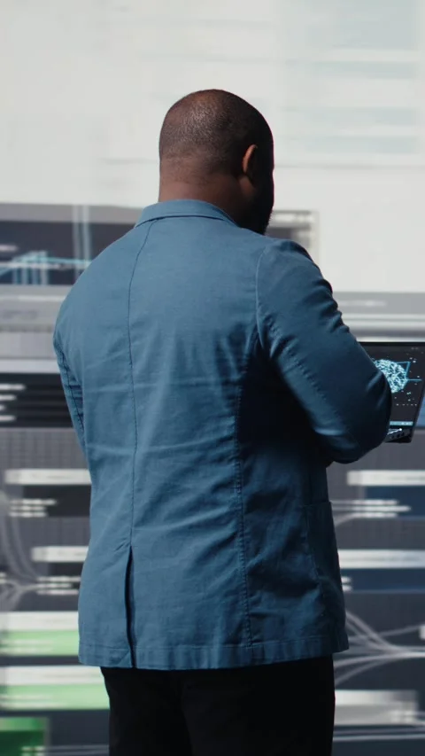Vertical Video African american coder expert immersing in software development Stock Footage 312124014
