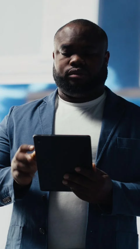 Vertical Video African American developer working on programming and automation Stock Footage 312177417