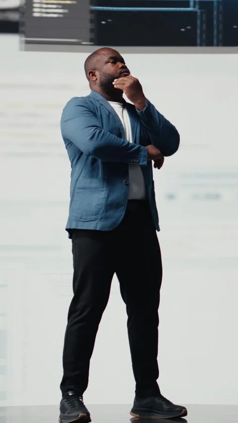 Vertical Video African American engineer analyzing programming language for Video stock 312123465