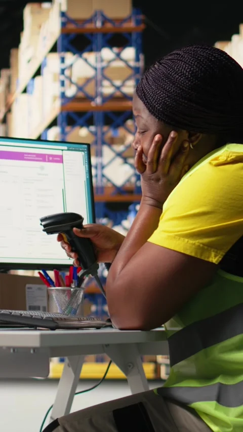Vertical Video African american overworked woman struggling to stay awake Stock Footage 312580029