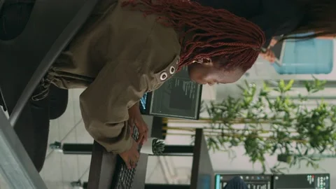Vertical video: African american programer typing source code on computer Stock Footage 220159940