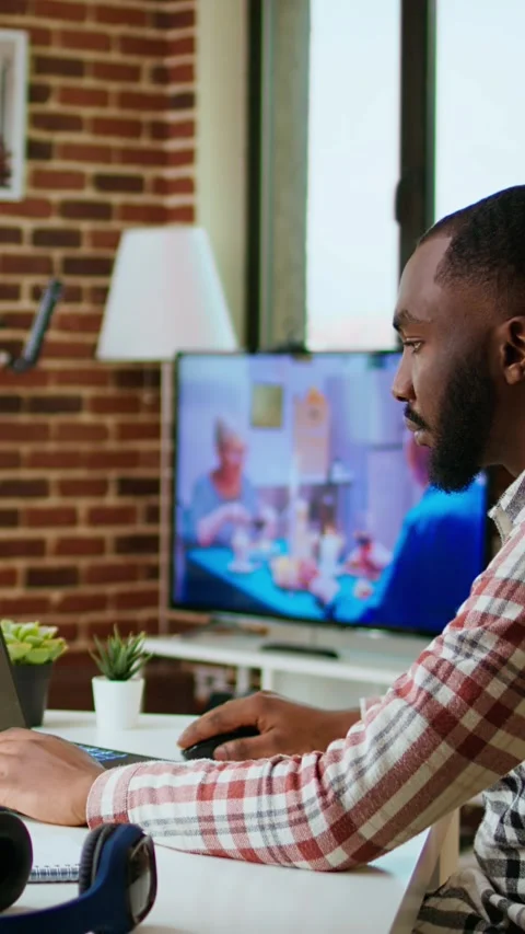 Vertical Video African american software developer works on programming code on Stock Footage 319475636