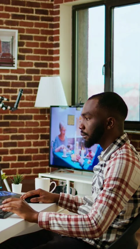 Vertical Video African american software engineer works on laptop typing code Stock Footage 323534407