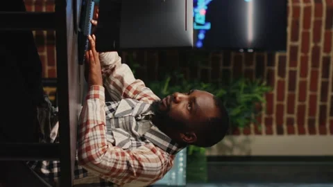 Vertical video: African american web developer working in artistic office to Video stock 223600337