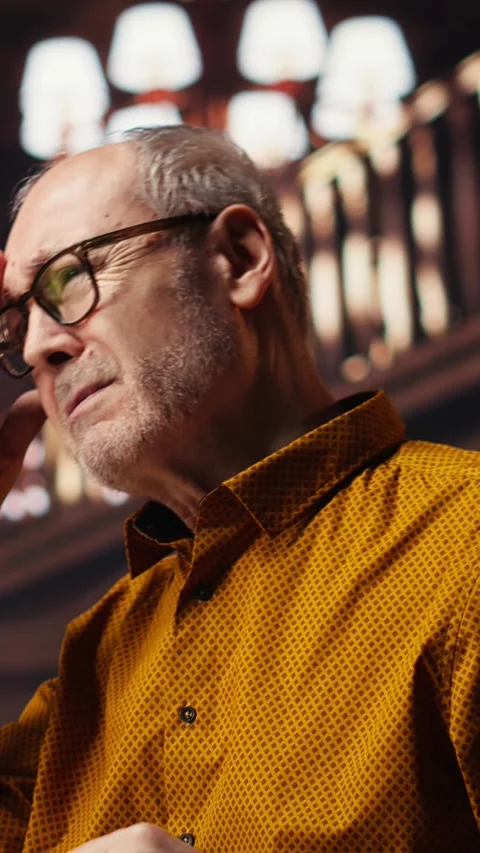 Vertical Video Aged performer engaged in dramaturgy and script practice with Stock Footage 313246461