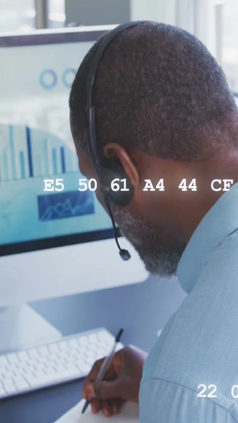 Vertical video: Agent hearing on mic viewing charts as data codes flowing Stock Footage 333236284