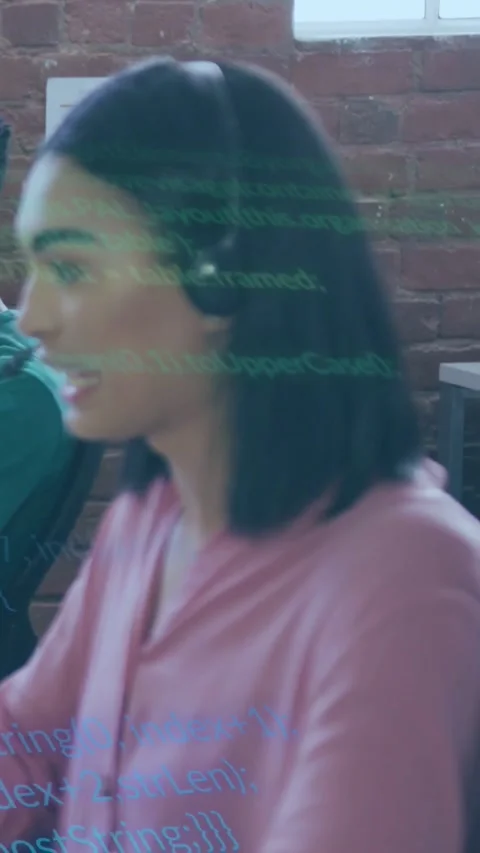 Vertical video: Agent taking call on headset, helping caller while code overlay Stock Footage 329934372