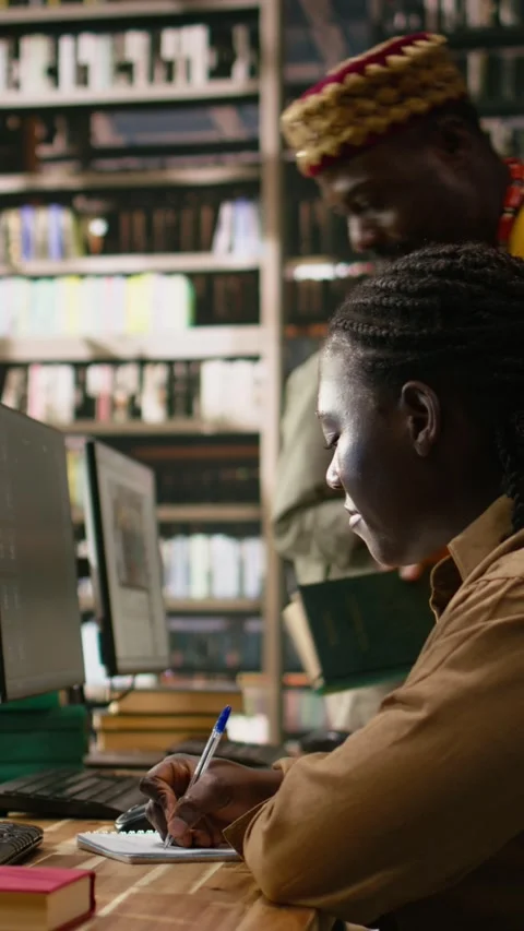 Vertical Video AI brain display filling desktop monitor in library study Stock Footage 337529330