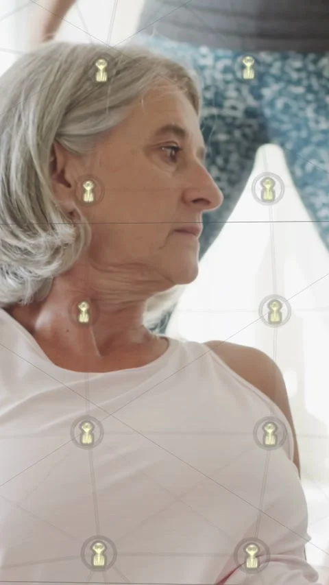 Vertical video: Aide coming from right helping woman relax as nodes showing blue Stock Footage 340133542