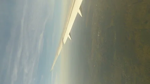 Vertical video of airplane wing during flight above Europe in 4k Stock Footage 171060717