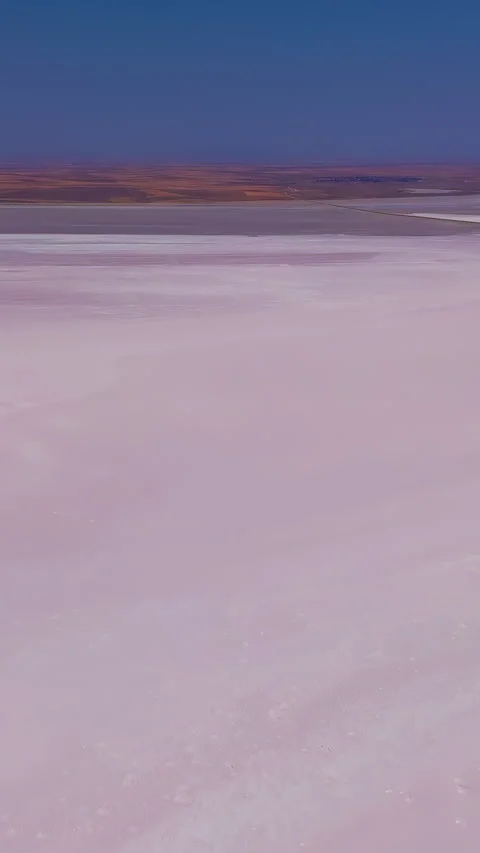Vertical video. Aksaray, Turkey. Tuz Golu salt pans, vast pinkish brine and Stock Footage 339764771