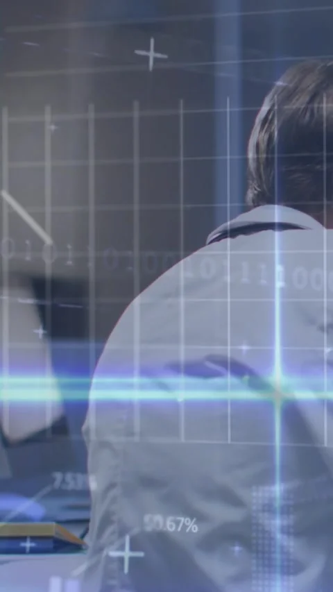 Vertical video: Analyst analyzing data feed starting, overlays appearing over Stock Footage 330195857