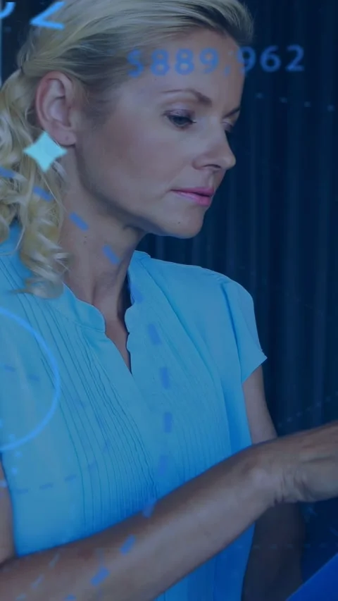 Vertical video: Analyst being prompted by blue tech overlays, handling glasses Stock Footage 333542111