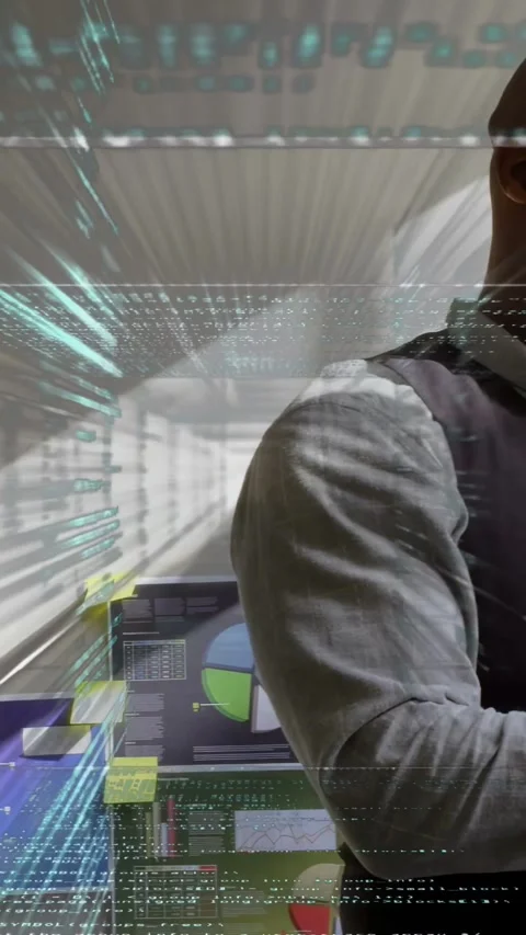 Vertical video: Analyst entering reviewing phone data while IT graphs and code Stock Footage 333021070