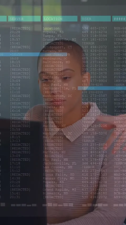 Vertical video: Analyst leaning to screen, peer pointing, showing data table Stock Footage 334549908