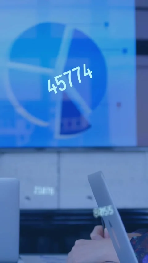 Vertical video: Analyst tapping tablet noting data camera rising live charts Stock Footage 335263902