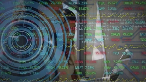 Vertical video: Analyst typing and glancing at laptop as live feed driving HUD Stock Footage 332544585