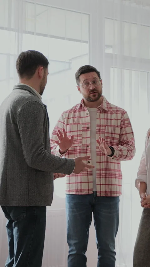 Vertical video Angry couple with real estate agent visiting apartment Stock Footage 340082496