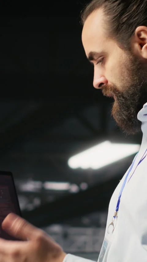 Vertical video Annoyed engineer in data center reacting to critical error Stock Footage 310771817