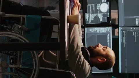 Vertical video: App developer with physical disability working on IT software Stock Footage 221655320