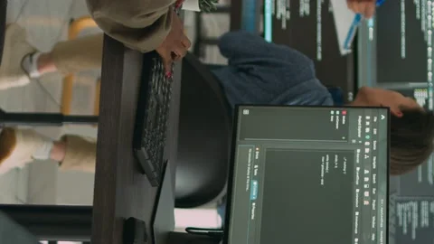 Vertical video: App software developer typing machine learning app code on Stock Footage 219701738