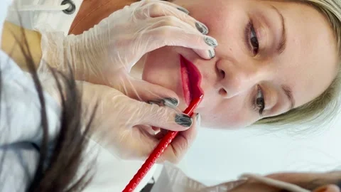 Vertical video of applies red paint Stock Footage 179052349