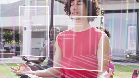 Vertical video: AR cue showing code bars over lawn while man in red meditating Stock Footage 332592299