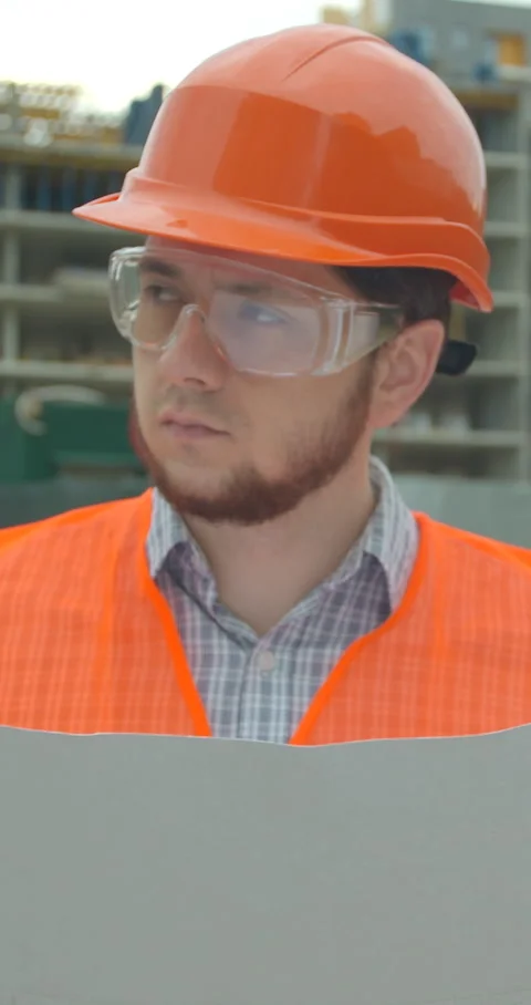 Vertical video. Architect analyzing project plan on construction site. Stock Footage 345503481