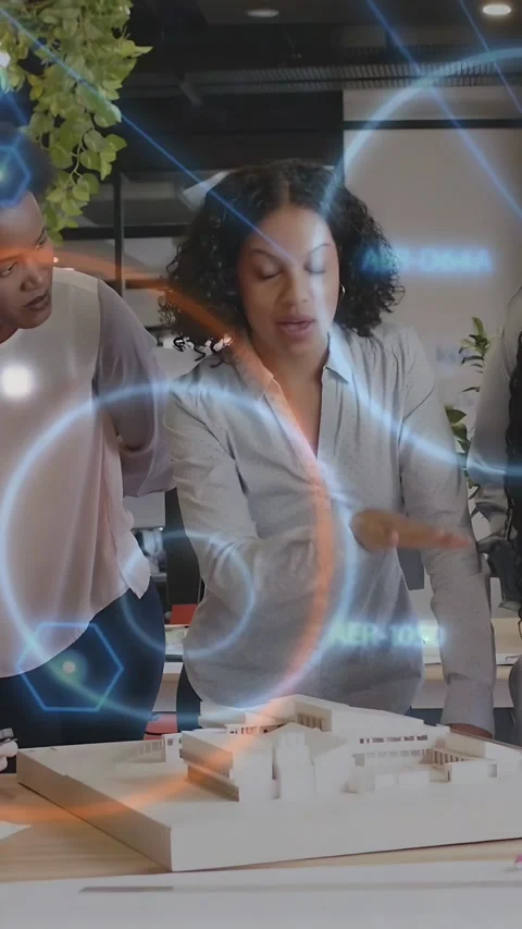 Vertical video: Architect leaning, explaining and pointing at model, causing AR Stock Footage 333527944