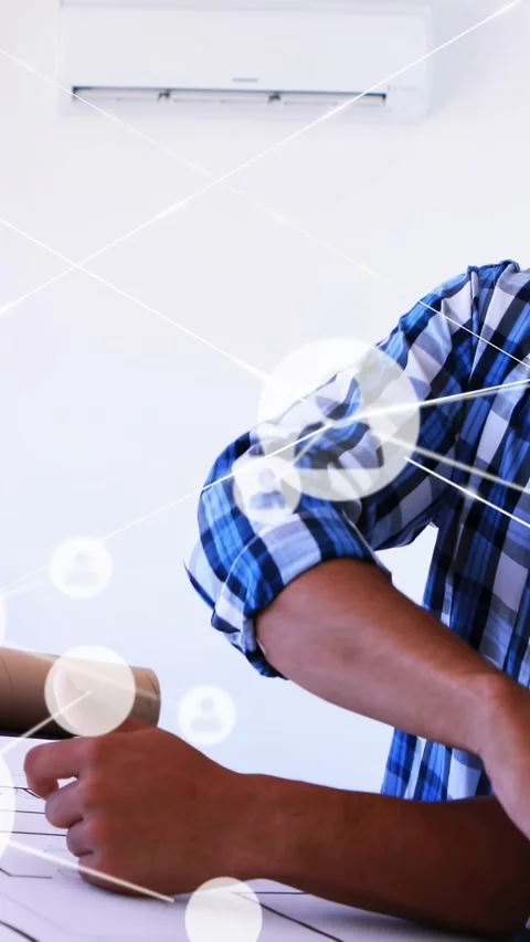 Vertical video: Architect placing compass on plan, measuring for review with Stock Footage 334600859