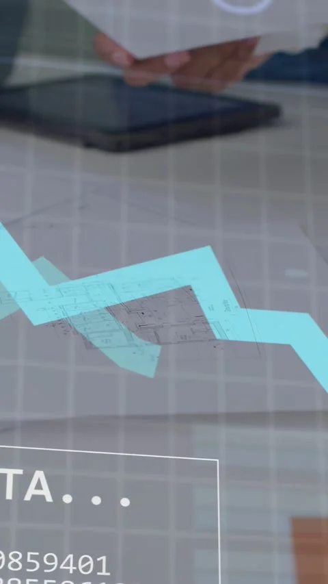 Vertical video: Architects placing paper and reviewing plan while HUD graphs Stock Footage 334771014