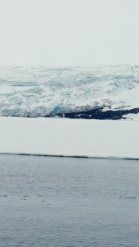 Vertical Video of Arctic Glacier and Sea Ice in Svalbard Stock Footage 340036856