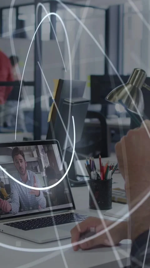 Vertical video: Arm moving lamp using mouse sparking light rays sweeping over Stock Footage 335263890